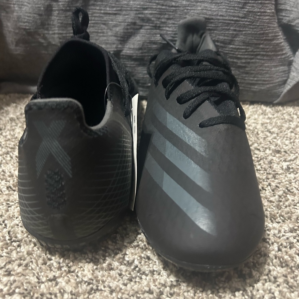 Adidas Black Soccer Shoes with Gray Stripes